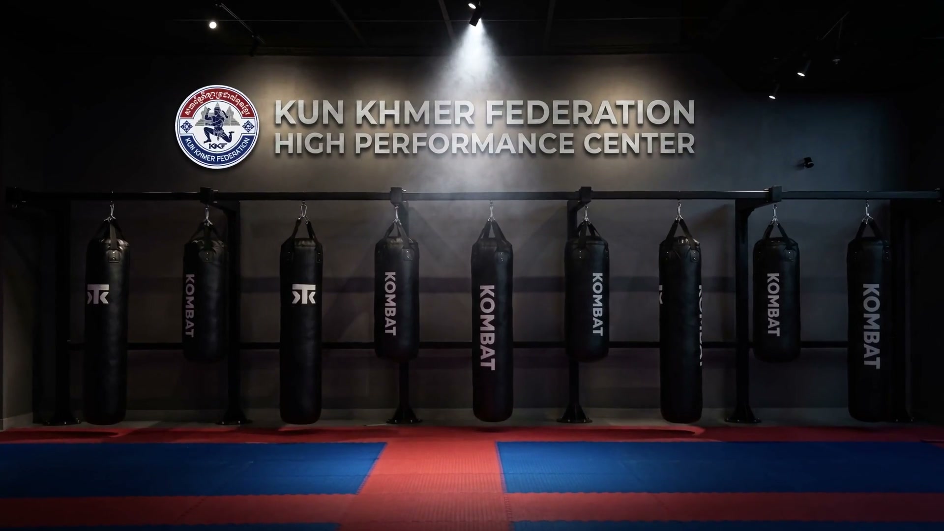 The mats and bag wall at Kombat Academy under the Kun Khmer Federation sign